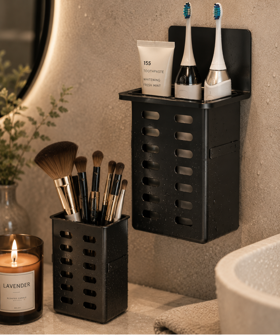 Bathroom setting with black wall-mounted organizer holding toothbrushes, toothpaste, and makeup brushes.