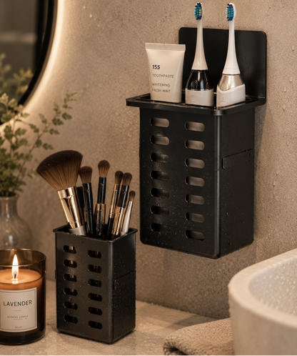 Bathroom setting with black wall-mounted organizer holding toothbrushes, toothpaste, and makeup brushes.